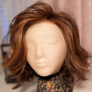 Flirt Alert, Bronzed Sable RL6/28, a wavy, short wig loaded with movement.